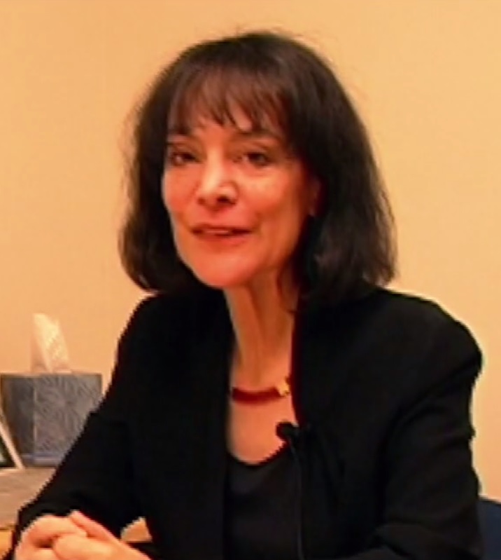 Creative Commons Attribution-Share Alike 3.0 Middle aged woman wearing black looking toward camera