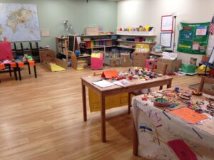 Elementary school classroom with tables full of materials