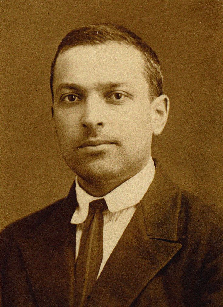 Public Domain A middle aged man wearing a suit and tie.
