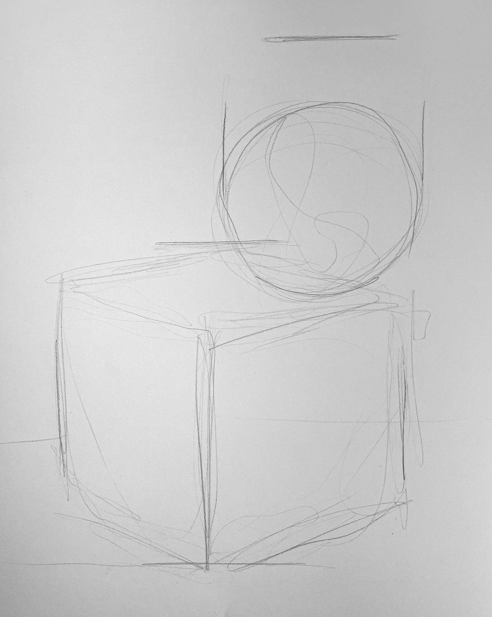A pencil sketch showing basic geometric shapes, including a cube and a sphere, outlined with light, overlapping lines. The drawing appears to be a preliminary study focusing on form and perspective without shading or detailed features.