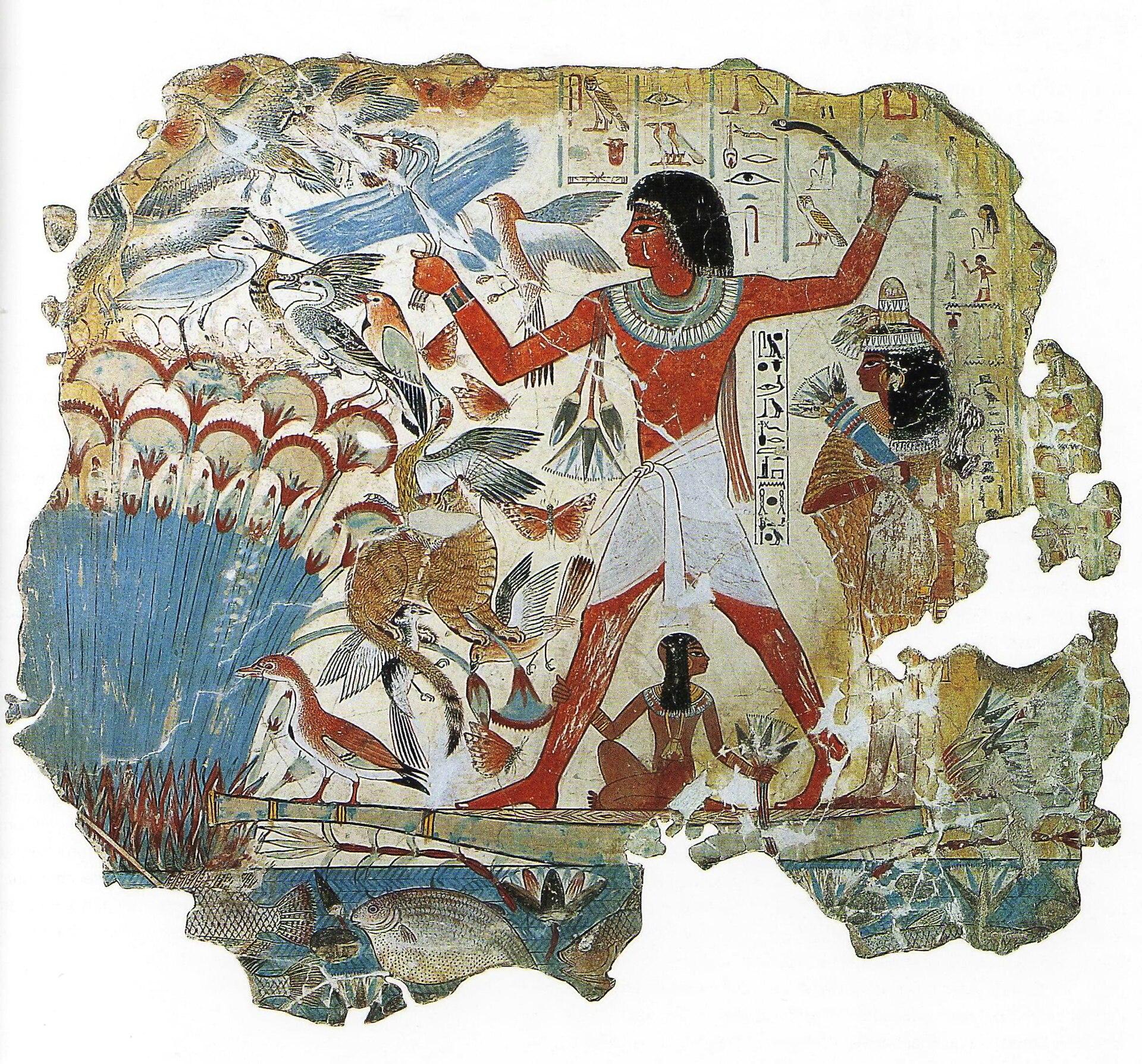 Ancient Egyptian wall painting depicting a man in traditional attire standing on a wooden platform surrounded by various birds and fish, with a woman and child nearby. The artwork features hieroglyphic inscriptions, vibrant colors, and detailed natural elements, illustrating a scene of hunting or fishing in a marsh environment.