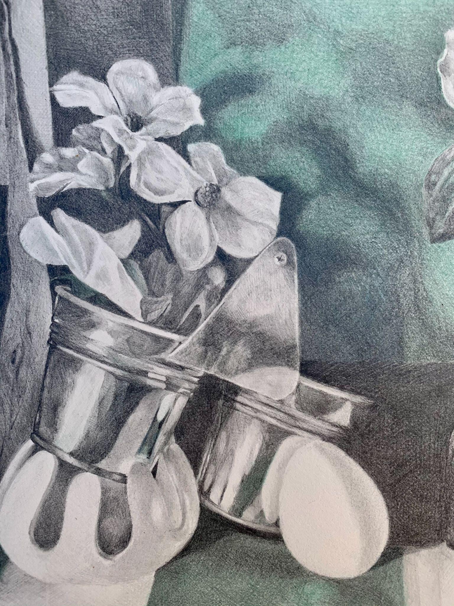 A detailed black and white pencil drawing of two reflective metal containers, one holding flowers with broad petals and leaves. The composition highlights light reflections and shadows on the containers, with a textured green background adding depth and contrast.
