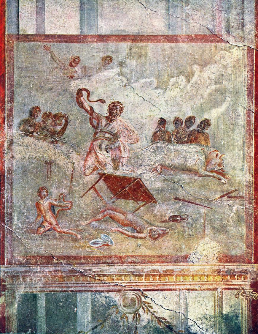 A fresco painting depicting a Laocoön in a chaotic scene with multiple human figures, including one central figure holding a snake and others seated or lying on the ground. The artwork features muted earth tones, a red border, and elements such as a fallen table, scattered objects, and a reclining animal, suggesting a narrative context.