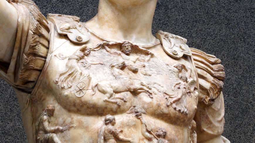 Detail of Sol and Caelus on the breastplate, Augustus of Primaporta, marble statue torso depicting a Roman soldier wearing detailed armor with intricate relief carvings of mythological and battle scenes. The statue features finely carved shoulder guards, highlighting craftsmanship and historical Roman military attire.