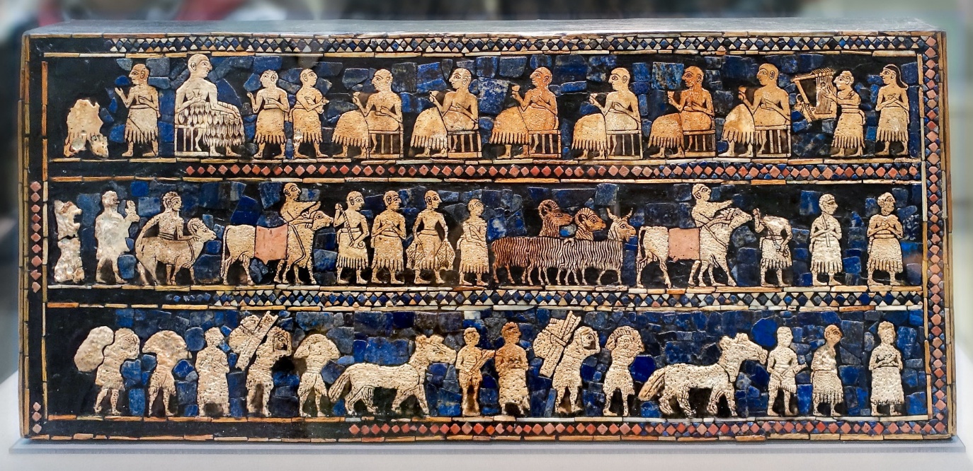 Photograph of Peace (detail), The Standard of Ur depicting a detailed narrative scene with multiple human and animal figures arranged in three horizontal registers. The artifact features intricate inlays of blue, white, and brown colors, highlighting various activities such as seated figures and standing individuals, showcasing cultural and ceremonial aspects.