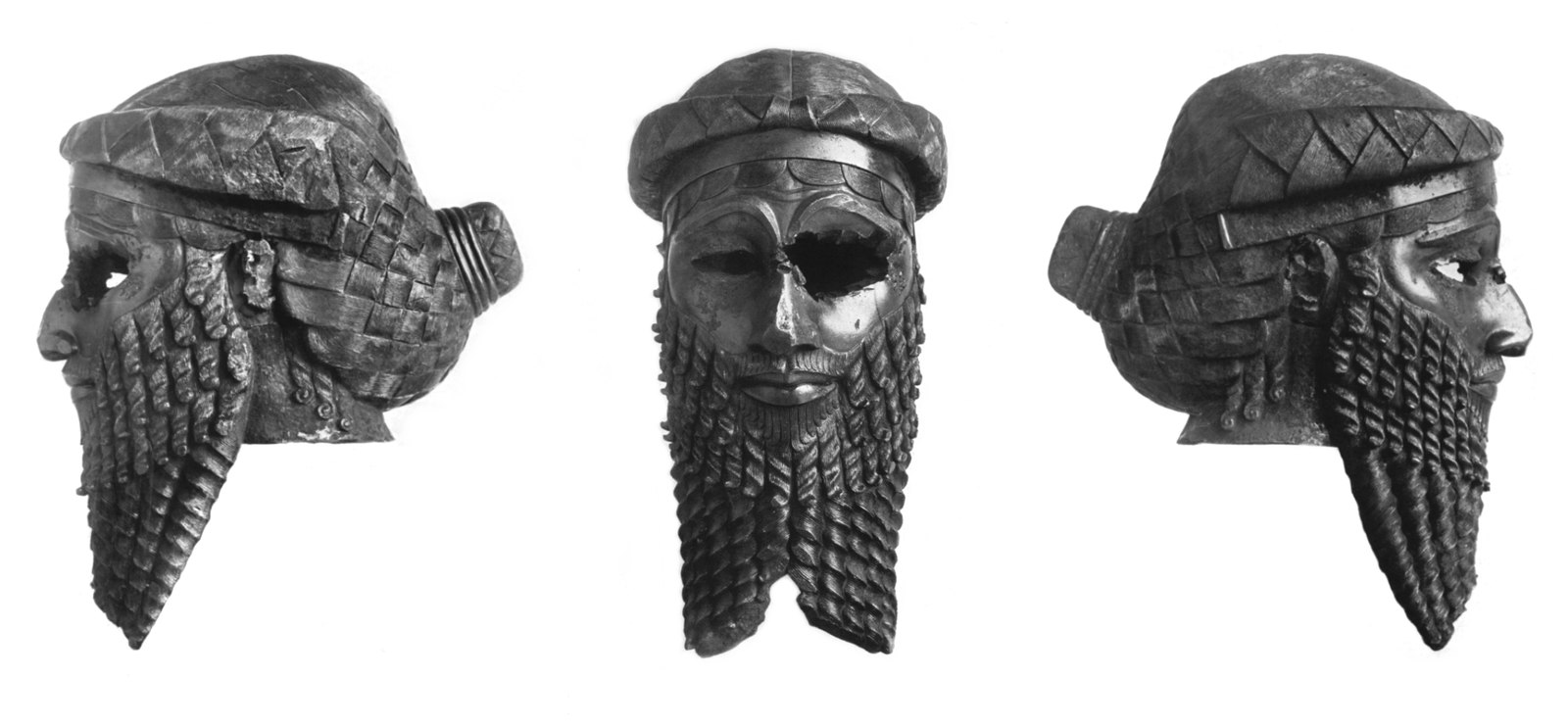 Photograph showing three views (left profile, back, right profile) of an ancient bronze head sculpture with detailed braided hair and beard. Sculpture features a patterned headband and intricate texture on hair and beard, highlighting craftsmanship and style from Akkadian Empire.