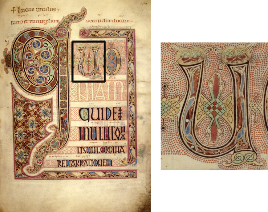 Illuminated manuscript page featuring intricate medieval calligraphy and decorative initials in red, blue, and gold tones. Close-up highlights detailed interlacing patterns and stylized letterforms typical of early medieval religious texts.