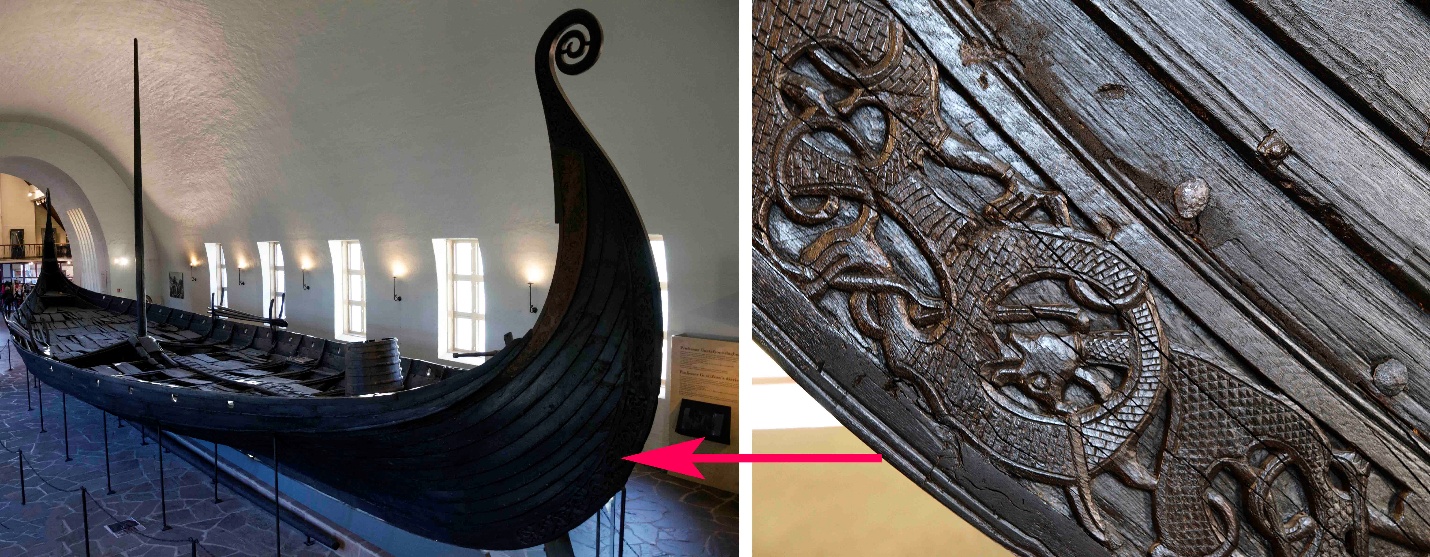 Photograph of a Viking ship displayed indoors, showcasing its long, narrow wooden structure with a high, curved prow. Close-up highlights intricate carved dragon and animal motifs on the ship's bow, emphasizing craftsmanship and historical significance.