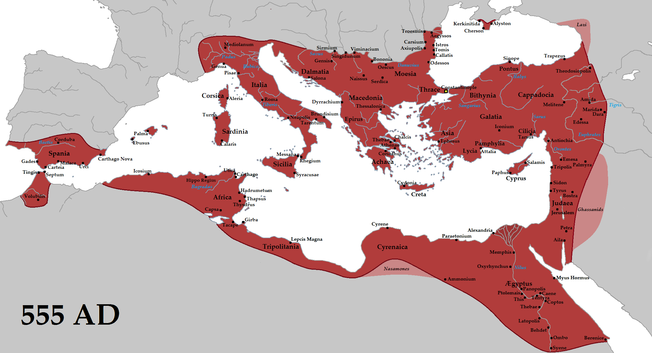 Map showing Byzantine Empire territory in 555 AD, highlighted in dark red across regions surrounding the Mediterranean Sea, including parts of Europe, North Africa, and the Middle East. Key cities and provinces are labeled in black text, illustrating the empire's extensive reach and control during this period.
