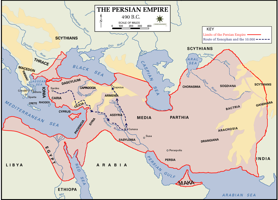 Map showing Persian Empire boundaries in 490 B.C., highlighting regions, cities, and surrounding bodies of water. Red solid line marks empire limits, while dashed blue line traces route of Xerxes and 10,000 troops, with key locations labeled and seas colored blue.