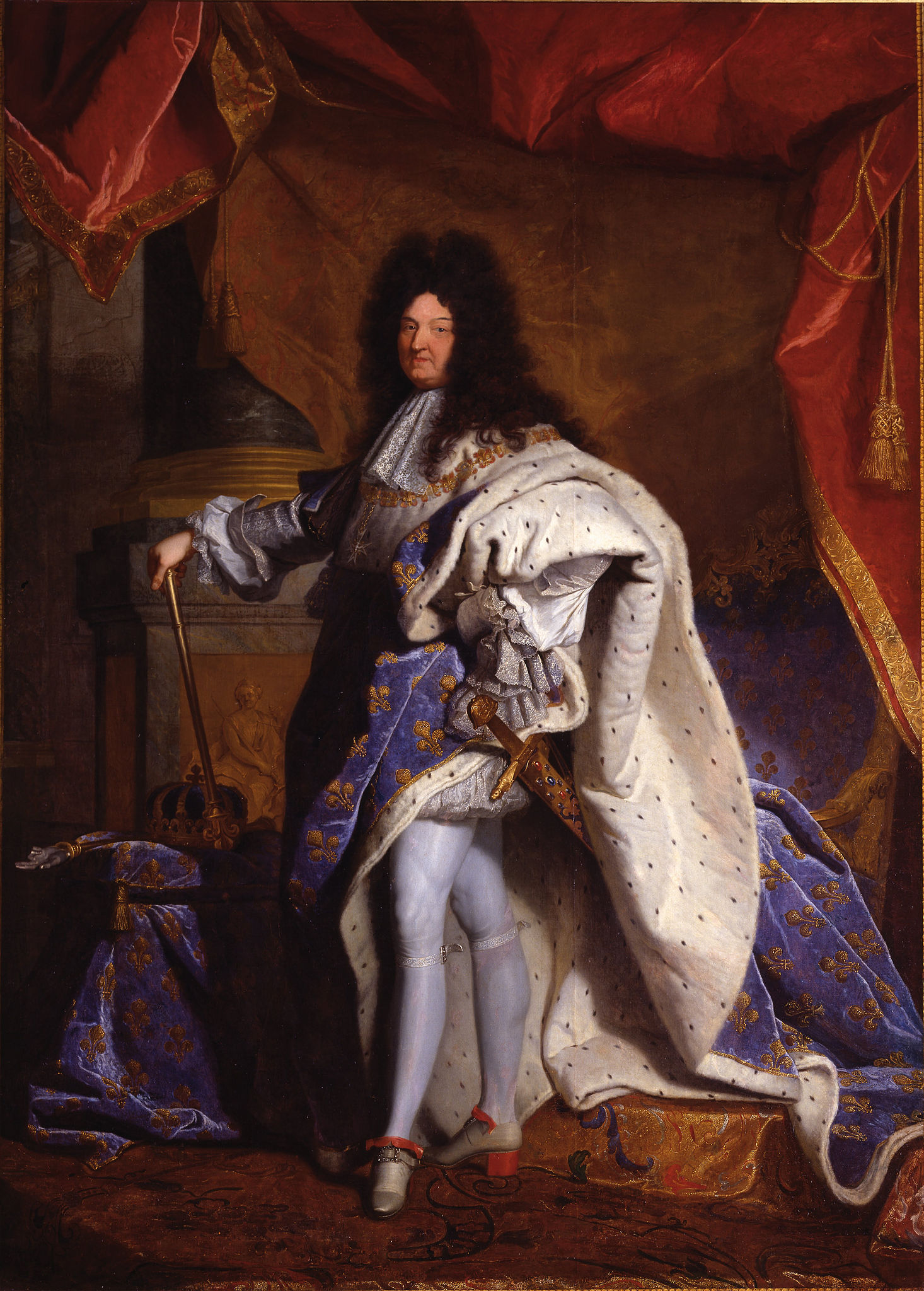 Hyacinthe Rigaud, Louis XIV, portrait painting depicts a regal figure dressed in elaborate royal attire, including a blue and gold embroidered robe with white fur trim and red-heeled shoes. The figure stands confidently with one hand on a cane and the other on a richly decorated throne, set against a backdrop of heavy red drapery and classical architectural elements.
