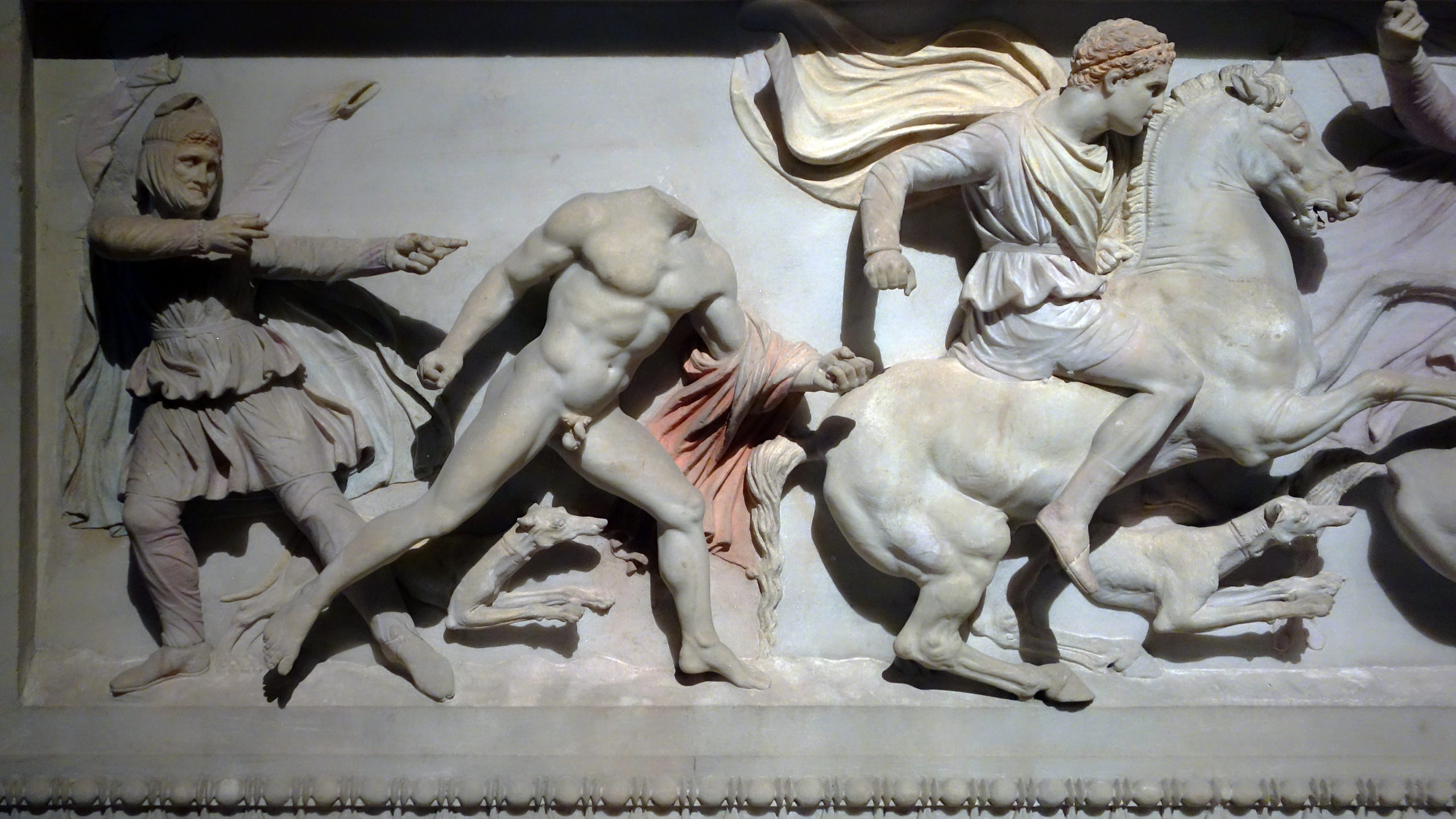 Detail of a classical relief sculpture featuring three human figures, one horse, and two dogs. One human figure is shown in the nude with an emphasis on anatomy and idealized forms.