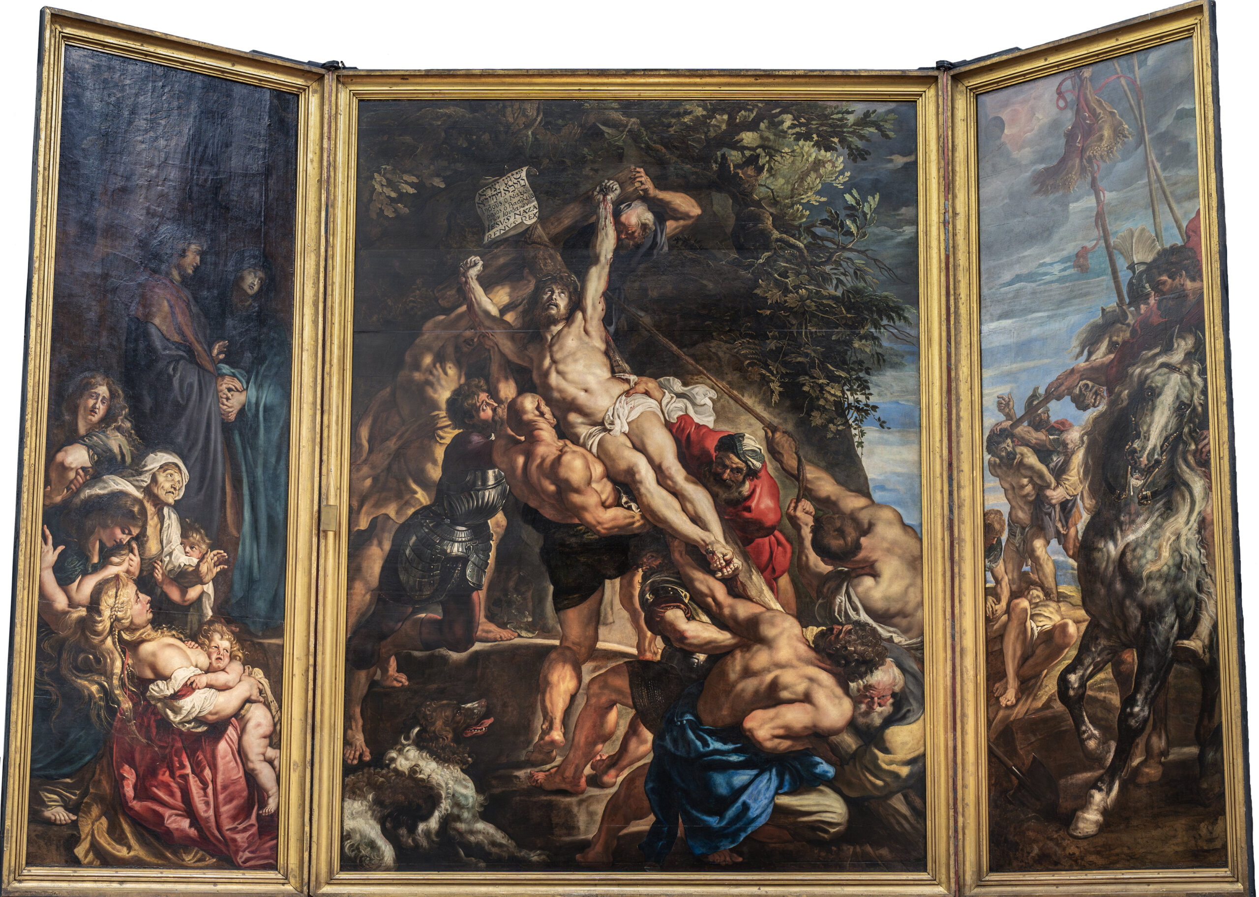 Triptych painting depicting a dramatic biblical scene with muscular men raising a crucified figure in the central panel, surrounded by mourners on the left and soldiers on horseback on the right. Rich colors and dynamic poses emphasize themes of sacrifice and sorrow, with detailed expressions and contrasting light enhancing emotional intensity.