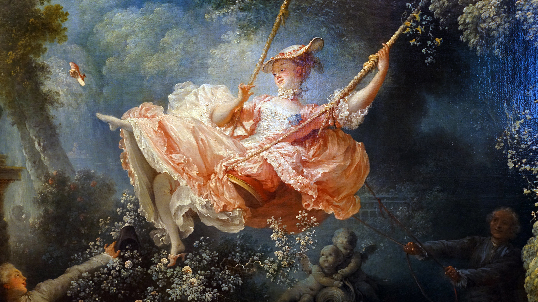 Female figure (detail), Jean-Honoré Fragonard, The Swing, depicting a young woman in an elaborate pink dress swinging joyfully from a tree branch in a lush garden. The scene features soft, pastel colors, intricate floral details, and two shadowed figures below, one holding the swing's rope.