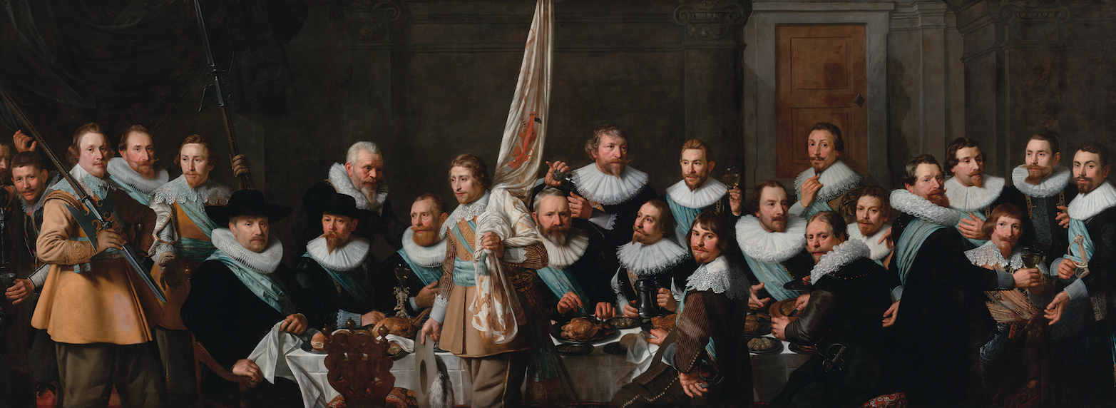 Nicolaes Eliasz Pickenoy, Civic guards from the company of captain Jacob Backer and lieutenant Jacob Rogh painting depicting a group portrait of men dressed in 17th-century attire, gathered indoors around a central figure holding a flag. The composition highlights detailed facial expressions, elaborate collars, and varied poses.