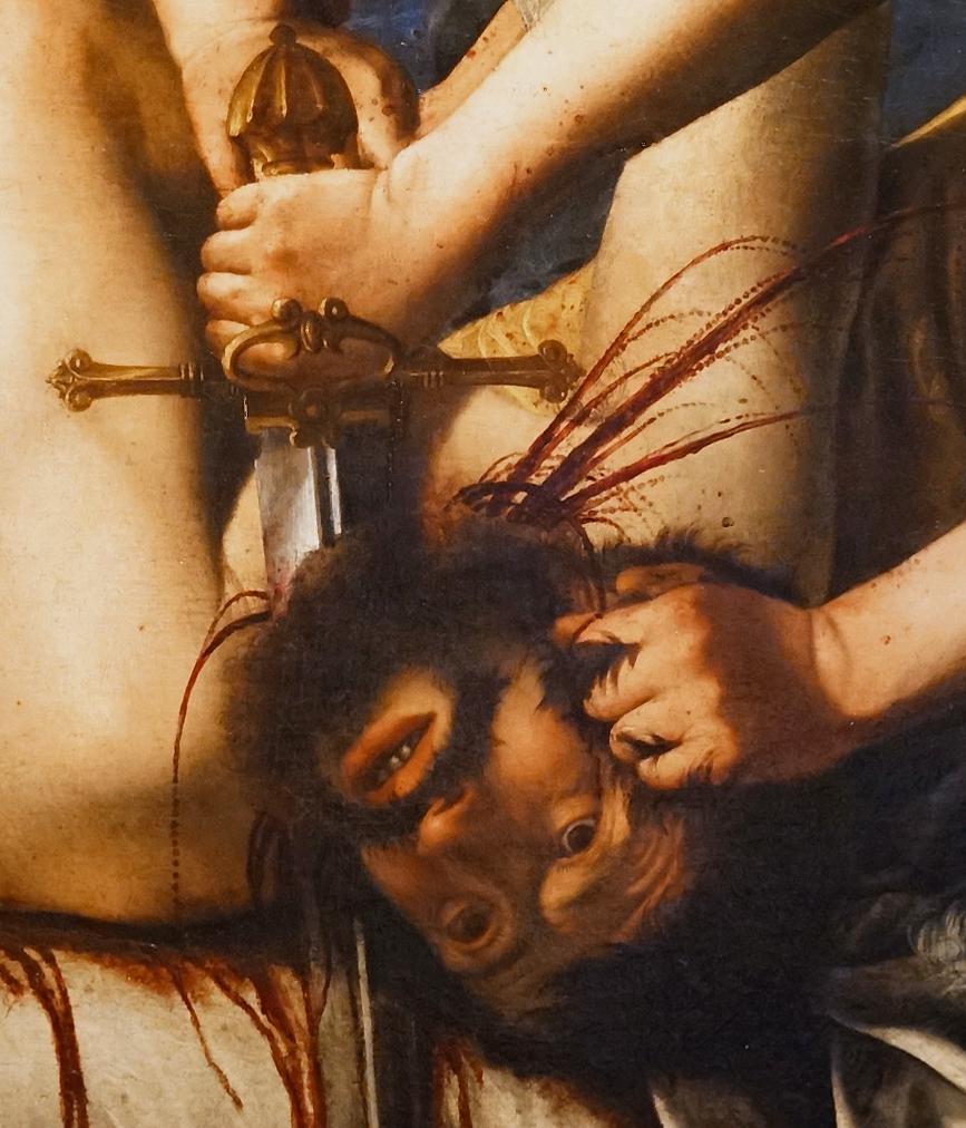 Detail image of painting showing a head being removed from a body with the figure's eyes wide open in fear and blood spurting from the neck.