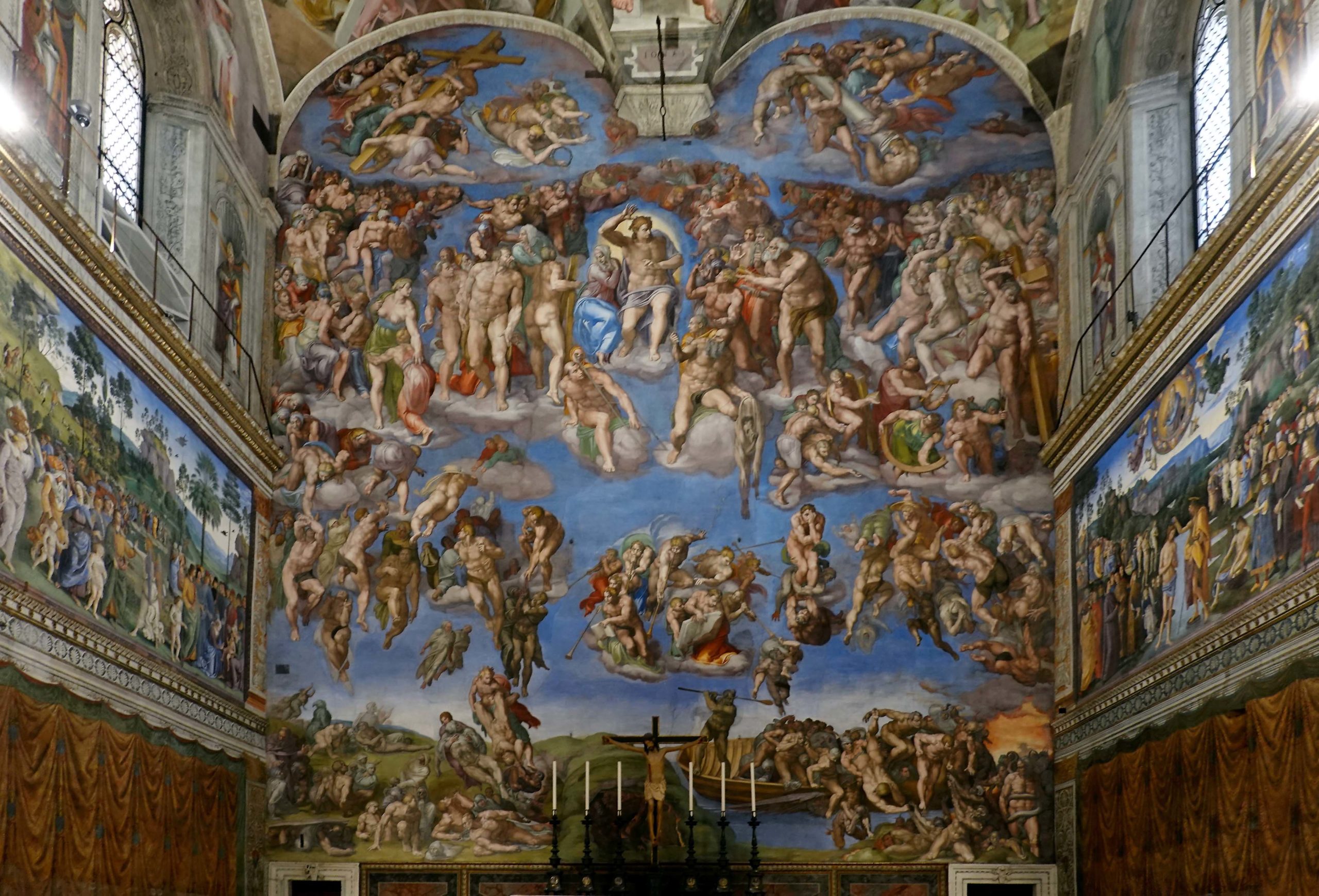 Michelangelo, Last Judgment, Sistine Chapel, altar wall fresco covering an entire chapel wall depicting numerous human figures in dynamic poses against a blue sky background. The artwork features detailed scenes of judgment and resurrection, with vibrant colors and intricate compositions framed by architectural elements and windows.