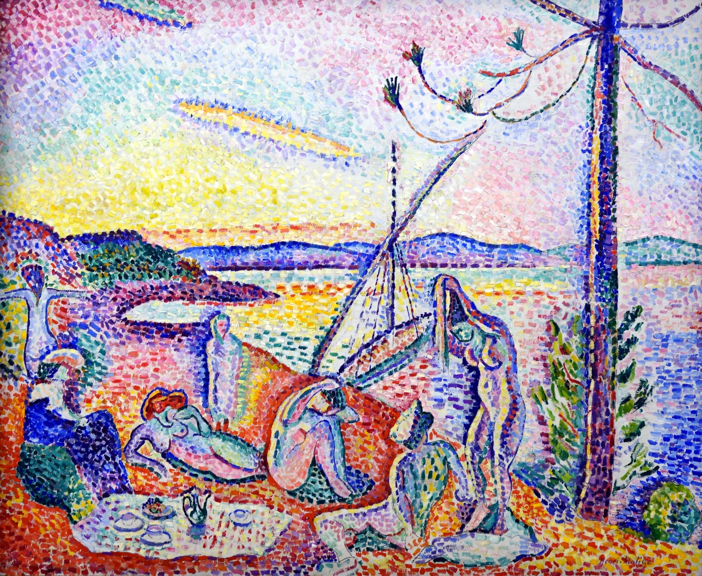 A pointillist painting depicting a group of people relaxing by the water with a sailboat in the background during sunset. The scene features vibrant colors with dotted brushstrokes, highlighting figures in various poses, a tree on the right, and a colorful sky blending pink, yellow, and blue hues.