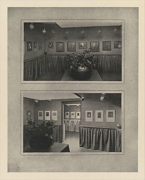 Two black-and-white photographs depict interior views of an art gallery with framed artworks displayed on walls above draped fabric panels. Both scenes include potted plants in the foreground, ceiling-mounted spotlights illuminating the artworks, and a cozy, intimate exhibition setting.