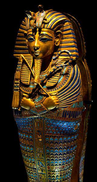 The golden and highly decorated sarcophagus of King Tut.