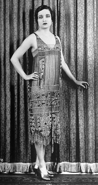 A person wearing a flapper dress